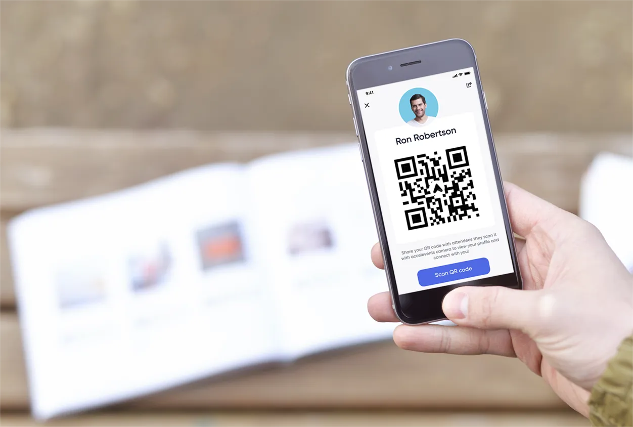Attendee scanning QR code with Base App at festival