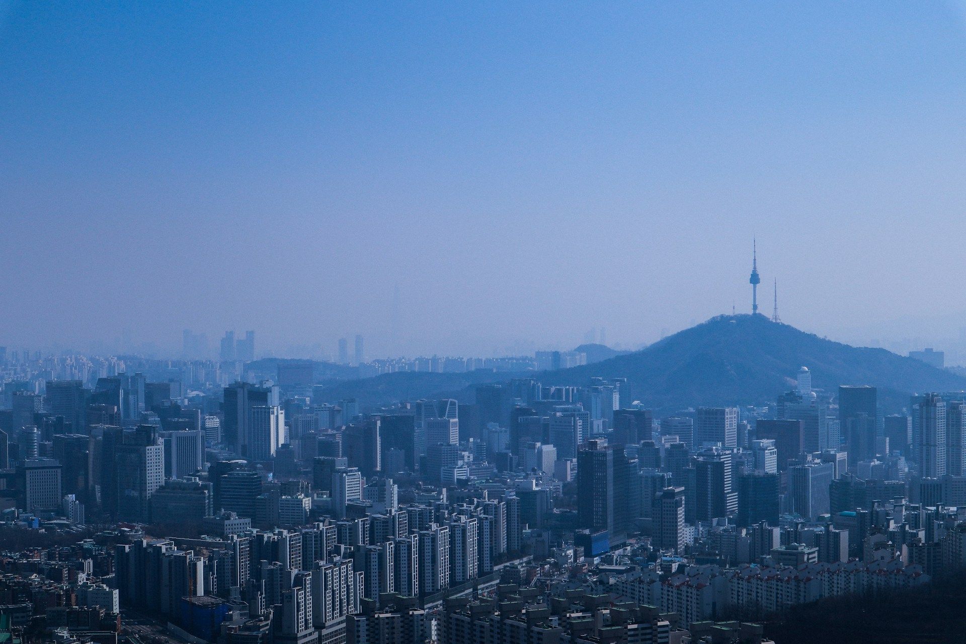 Bustling Seoul financial district with digital asset tickers overlayed, illustrating South Korea's crypto regulatory reforms impact on global markets.