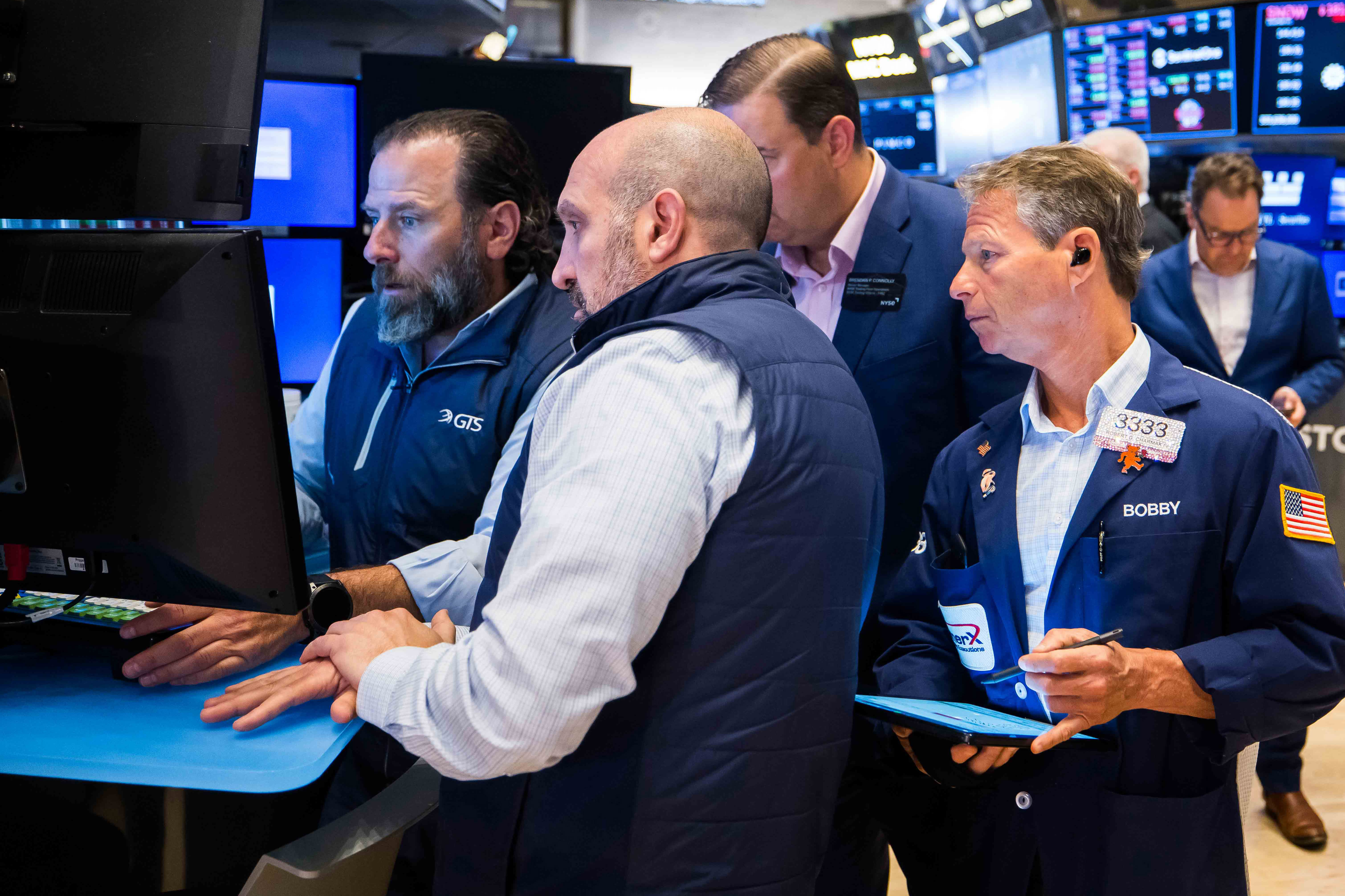 Bustling trading floor at a major U.S. bank with digital asset and traditional financial tickers on large screens, symbolizing integration of crypto services in banking 2024