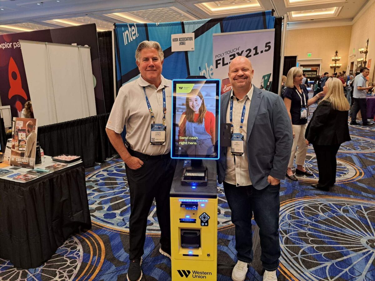 Busy Western Union branch with customers at digital kiosks and traditional counters, illustrating the integration of digital and cash remittance services