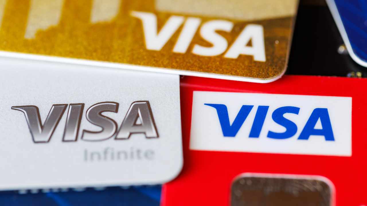 Close-up of a modern stablecoin Visa card with digital wallet icons, representing seamless crypto payments