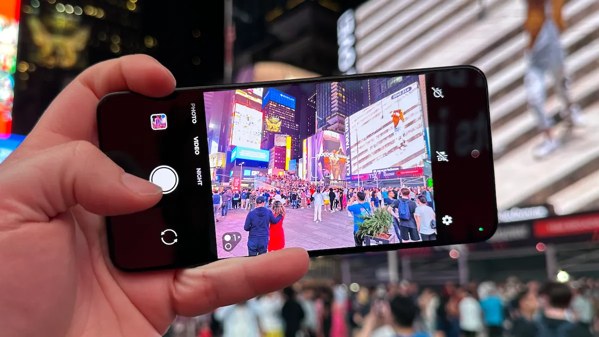 Close-up of Solana Saga phone showing biometric authentication prompt for secure DeFi transactions