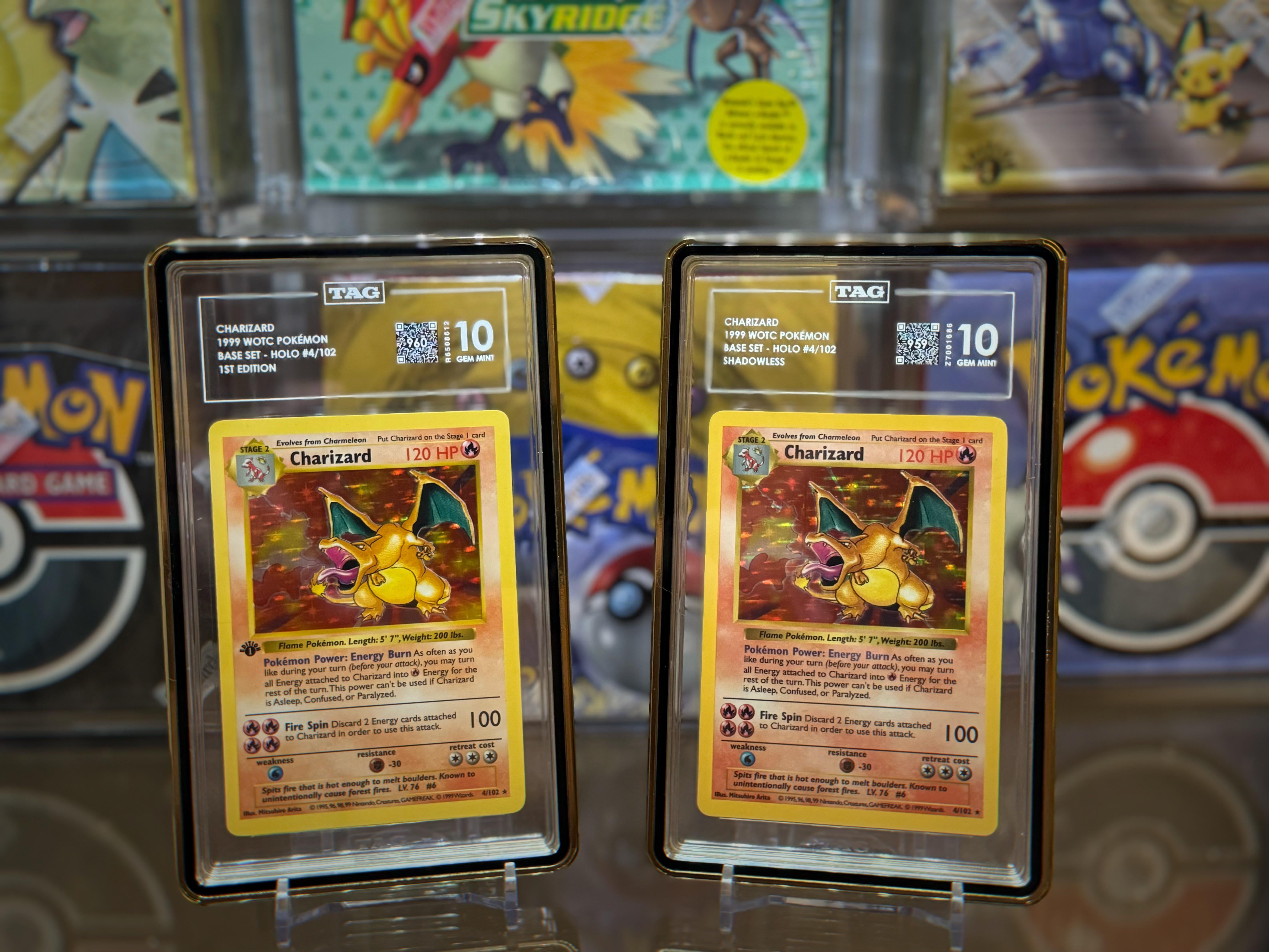 Hand holding a classic Base Set Charizard Pokémon card alongside its NFT version displayed on a smartphone, symbolizing the fusion of physical and digital collecting in 2025.