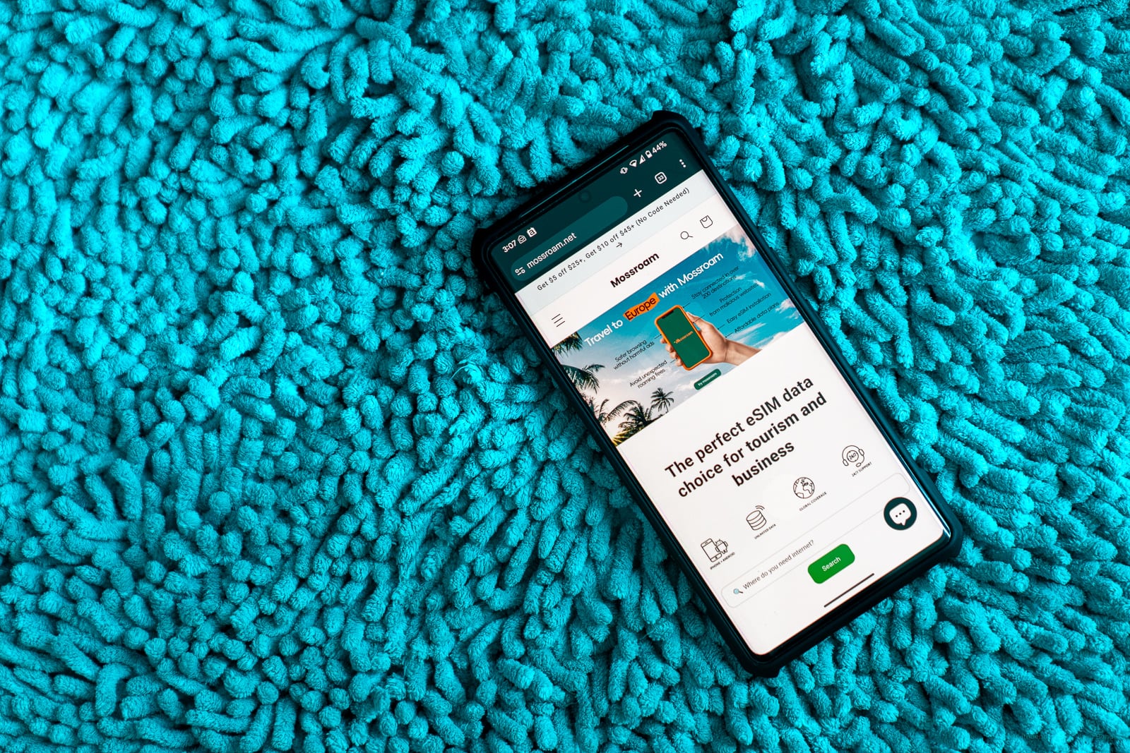 Digital nomad receiving USDC payroll notification on smartphone, representing global stablecoin payments in 2024