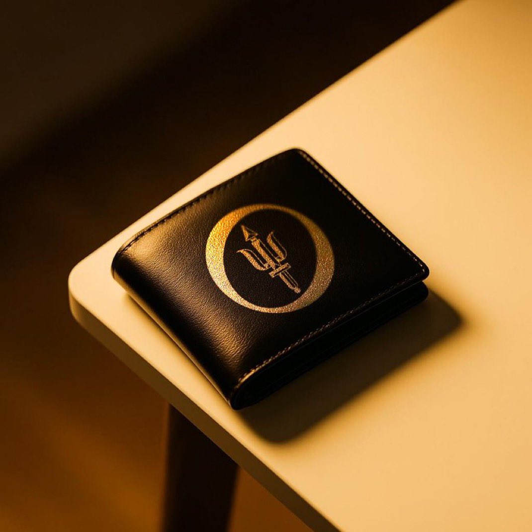 Sleek black anonymous crypto debit card on a neon-lit desk, representing top no-KYC crypto cards for 2025