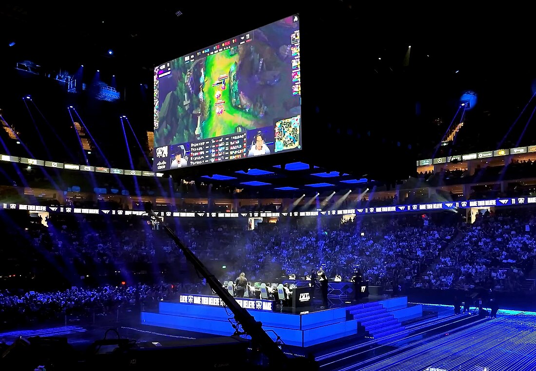 Fans holding Bitcoin signs at League of Legends Worlds 2025 arena, showcasing crypto esports betting excitement