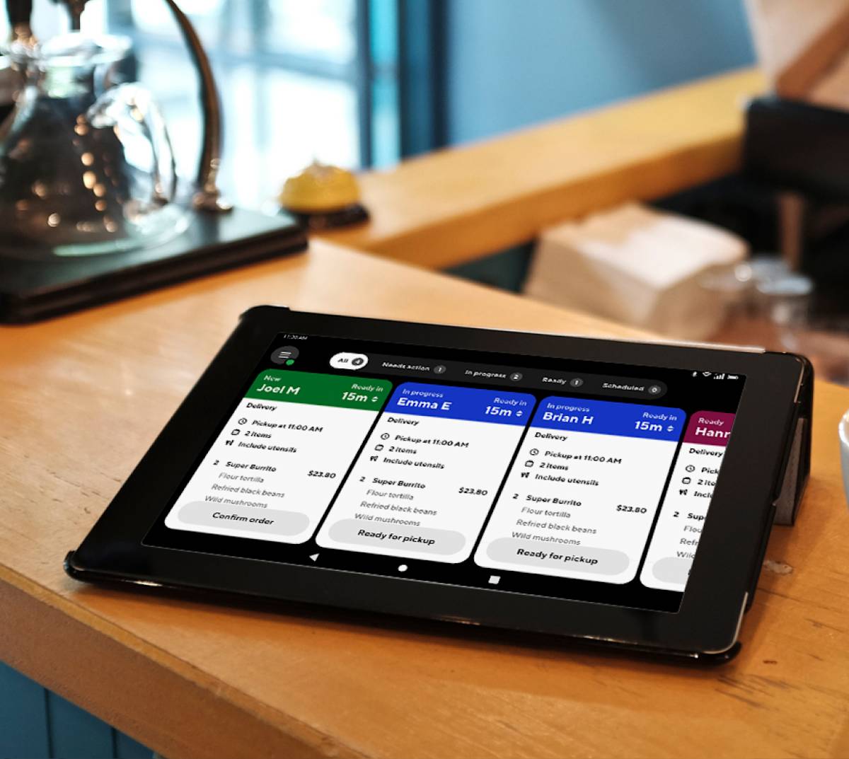 Merchant using a tablet POS system showing USDC Base payment confirmation at checkout