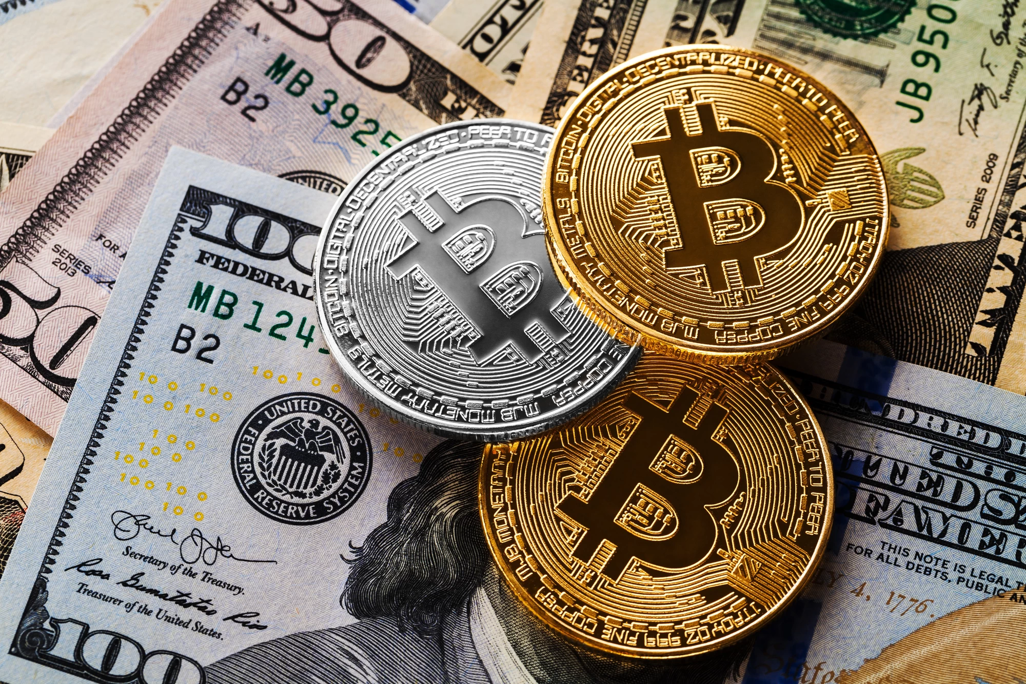 Digital euro symbol overlaying logos of UniCredit, ING, Banca Sella, KBC Group, Danske Bank, DekaBank, SEB, CaixaBank, and Raiffeisen Bank International representing European stablecoin consortium