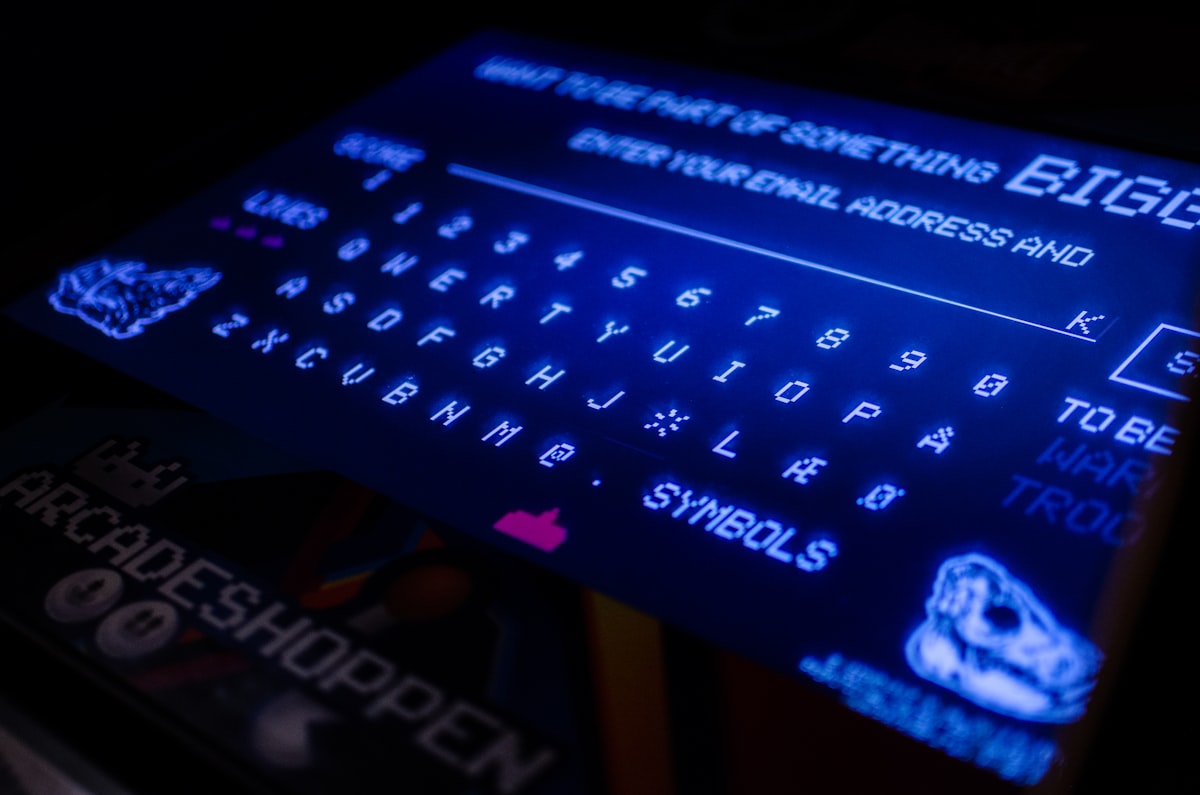 Modern fintech team discussing GENIUS Act 2025 stablecoin compliance on digital devices in a collaborative office setting