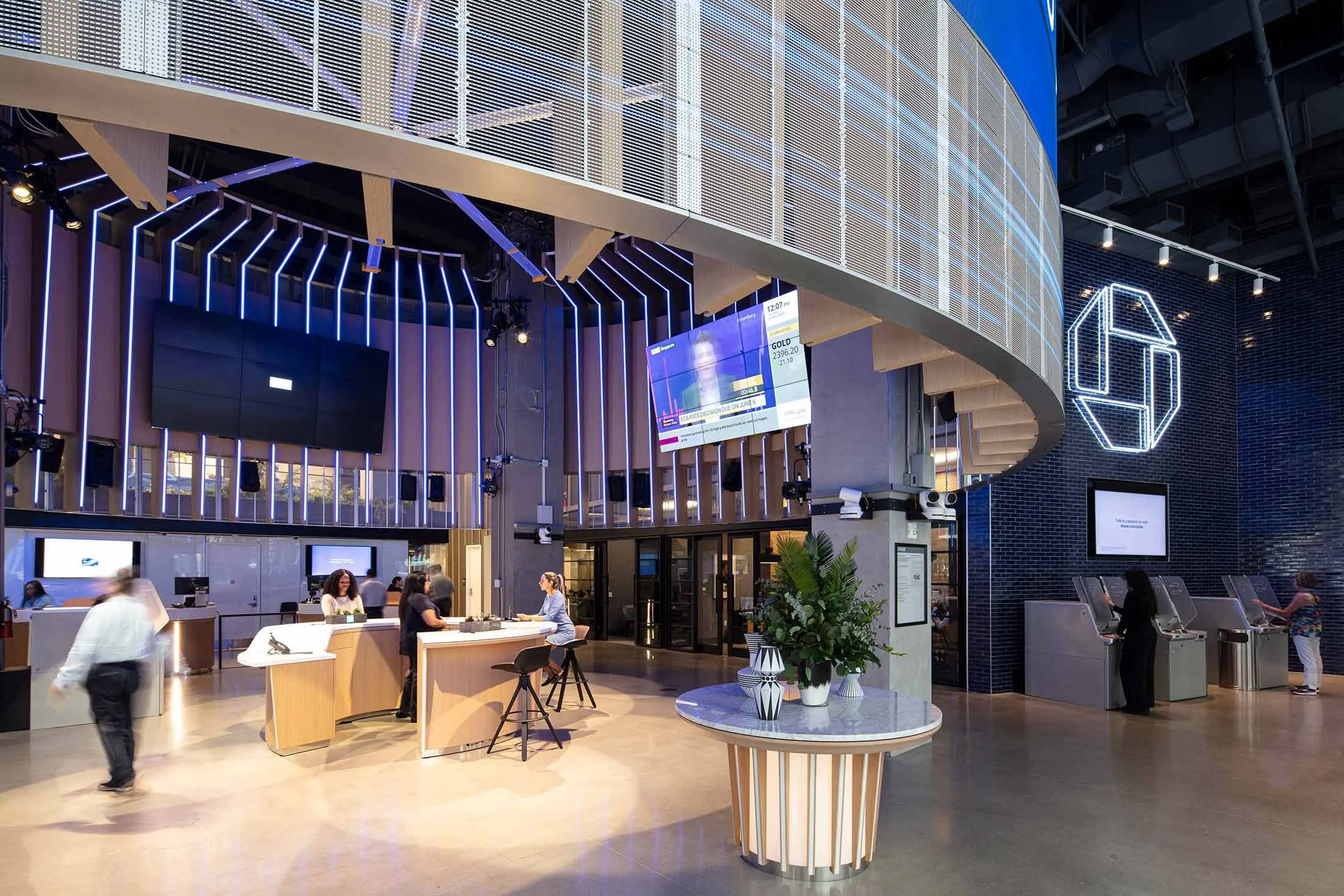 Modern U.S. bank branch interior with digital asset kiosks and cryptocurrency branding in 2024