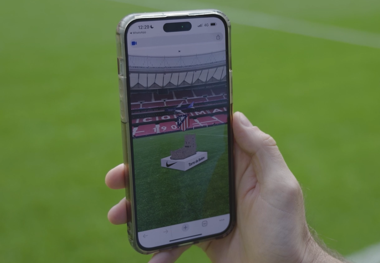 Packed football stadium with fans holding smartphones displaying fan token apps, showcasing modern matchday engagement and digital fan participation.