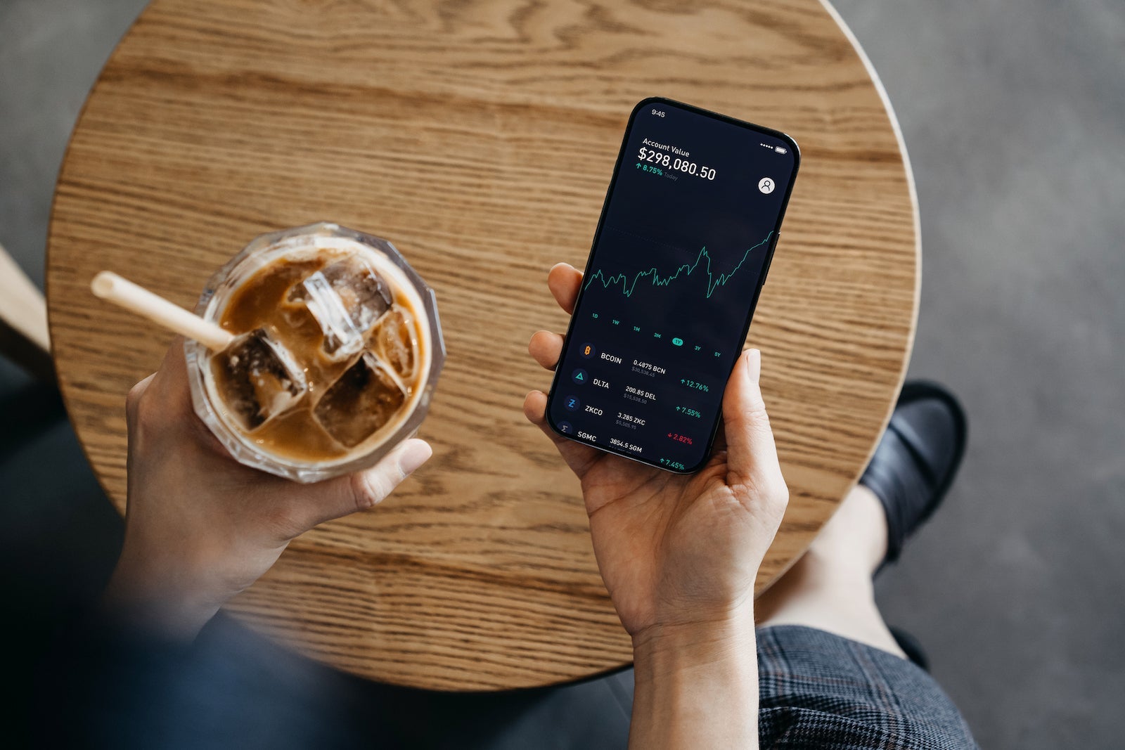 Person comparing multiple crypto rewards cards on smartphone, focusing on maximizing governance token benefits in 2024
