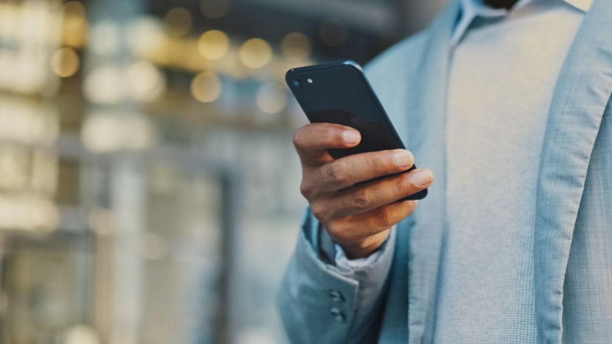 Remote team celebrating after receiving instant USDC payroll on their smartphones, showcasing global crypto salary payments