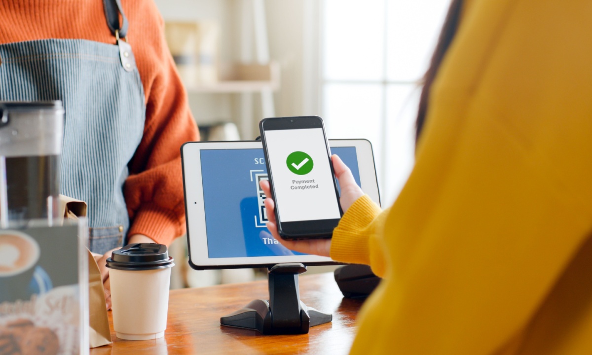 Sleek digital wallet app on smartphone displaying USAT and multiple stablecoins for crypto beginners in 2025
