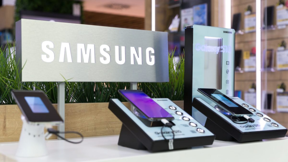 Smartphone displaying Walmart OnePay app with Bitcoin and Ethereum icons, representing new crypto trading features