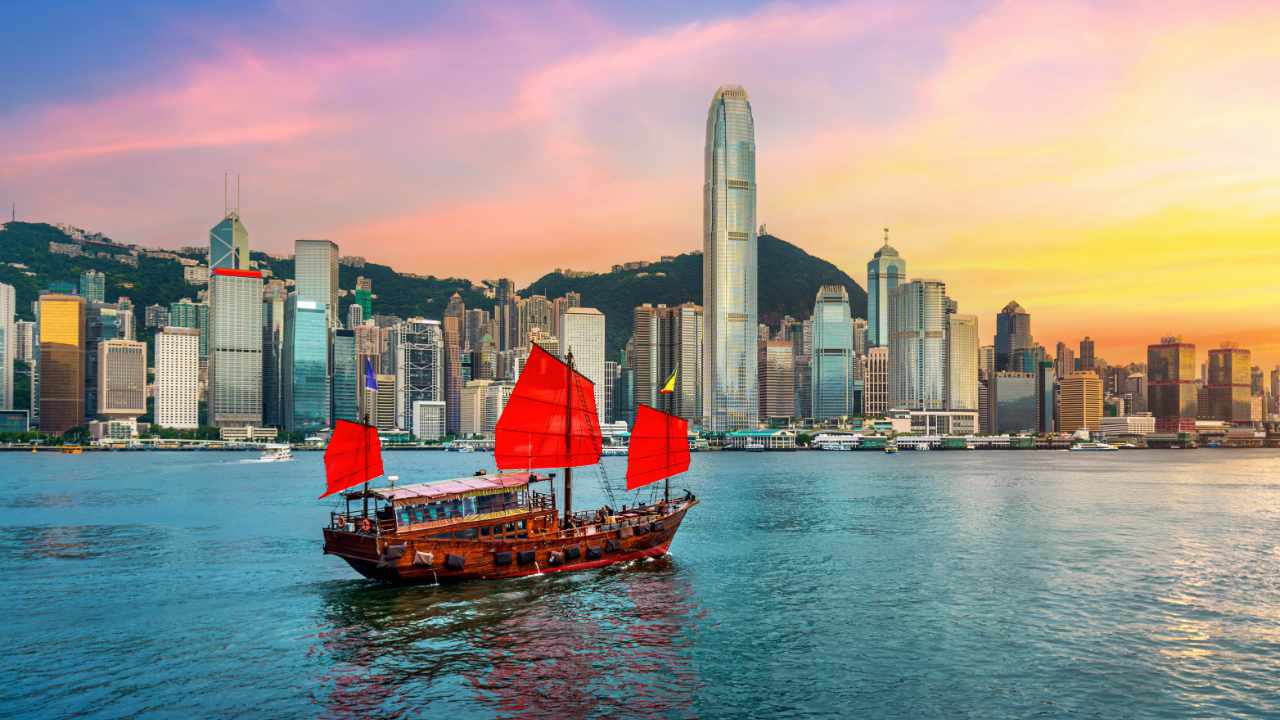 Hong Kong skyline with digital coin symbols overlay, representing stablecoin regulation and digital asset innovation in 2025