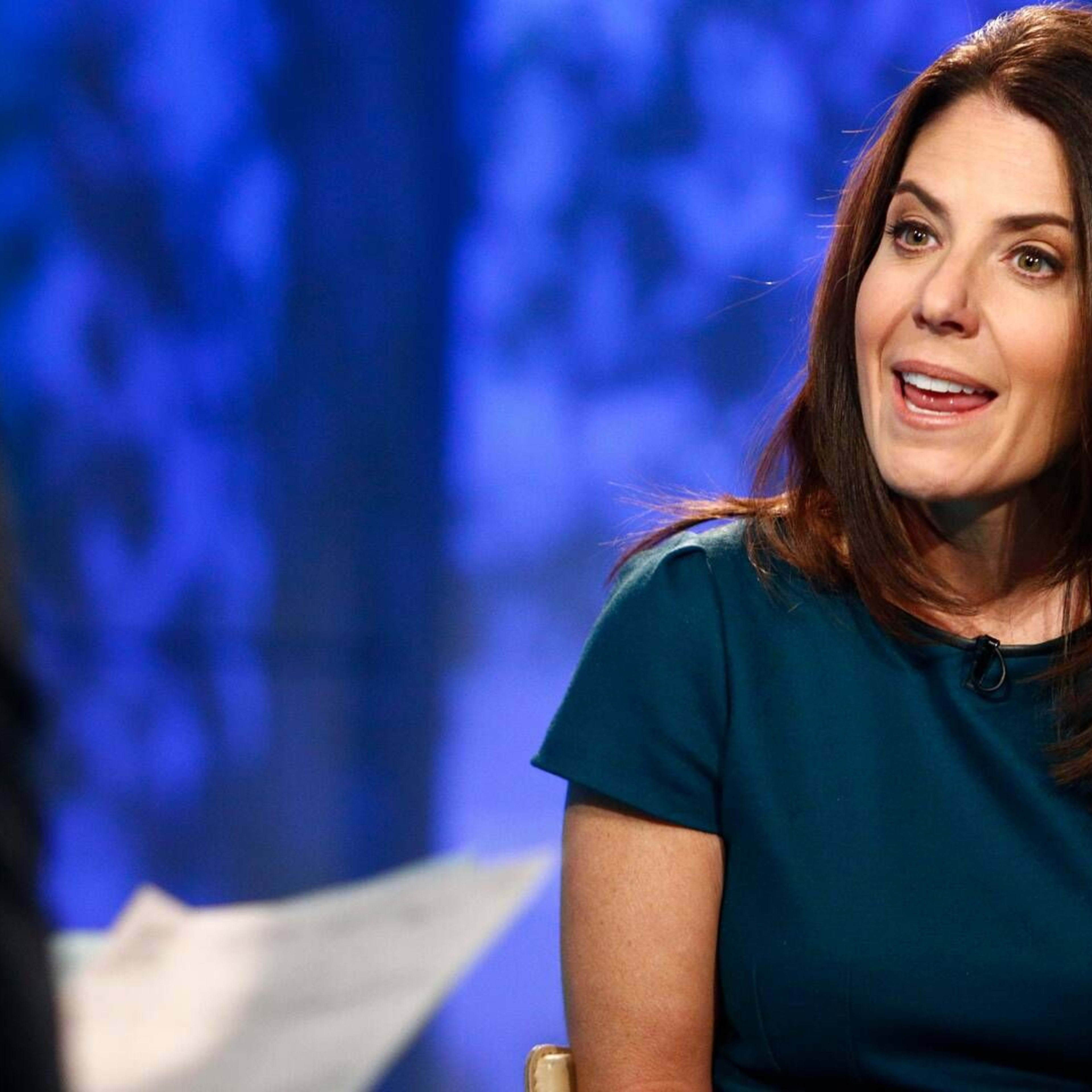 Thoughtful retiree woman reviewing her 401(k) statement with Bitcoin ETF allocation, symbolizing crypto in retirement planning, 2025