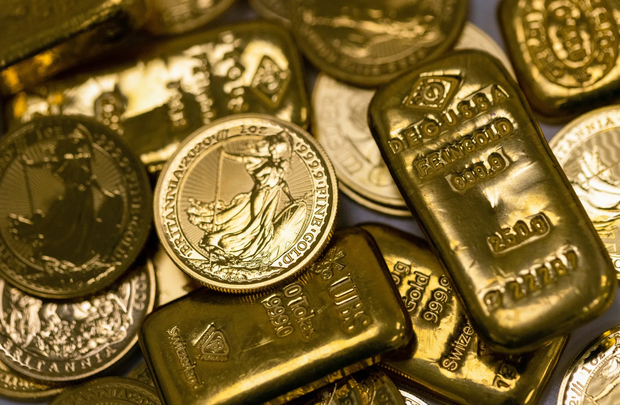 A secure vault filled with stacked physical gold bars, digitally connected to blockchain tokens representing tokenized gold in DeFi.