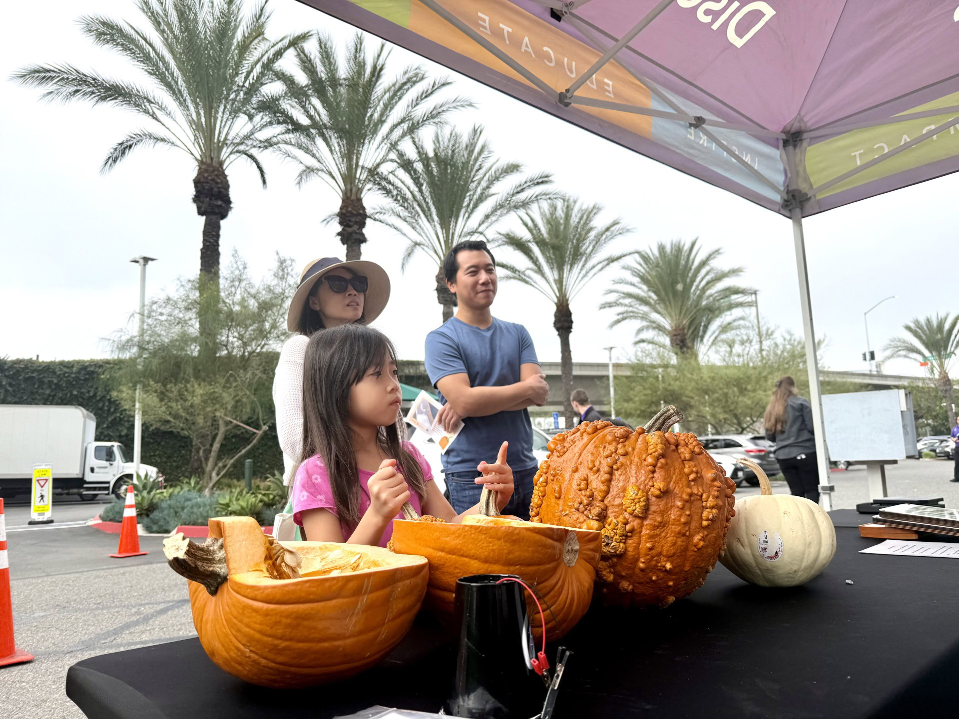 AI gaming arena in 2025 with bots competing on digital screens, organizers at control panels, and a cheering audience