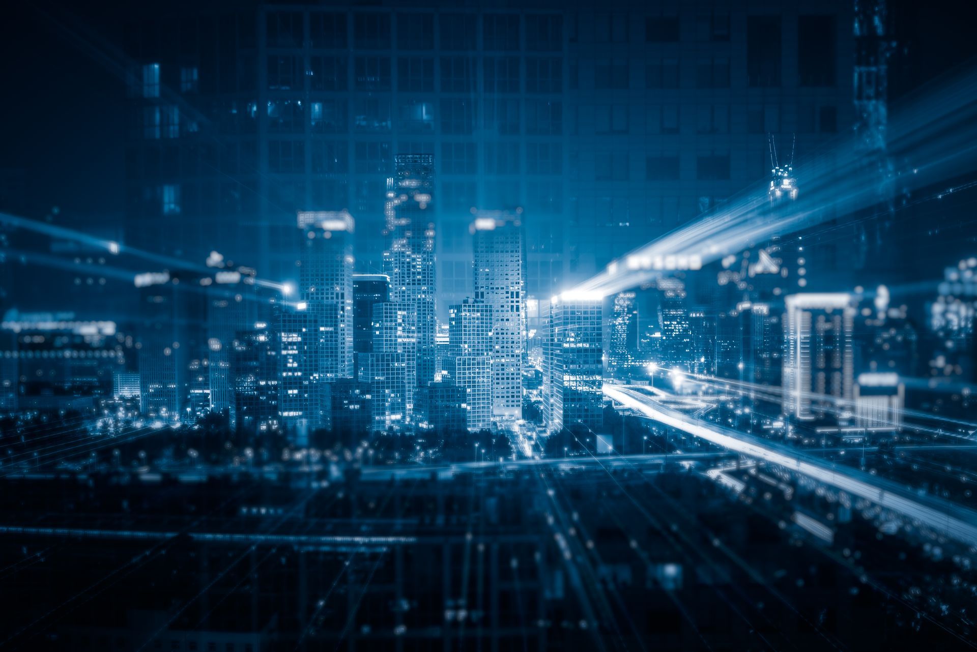 Vibrant smart city skyline at night with digital network overlays illustrating IoT connectivity and Helium 5G infrastructure