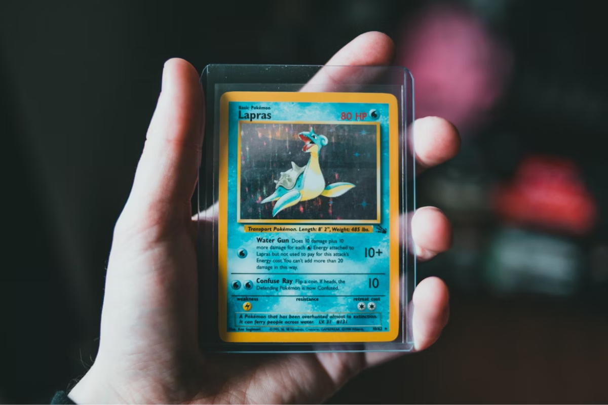 Vibrant holographic graded Pokémon card NFT tokenized as RWA on Solana blockchain, showcasing shiny collectible with crypto blockchain elements