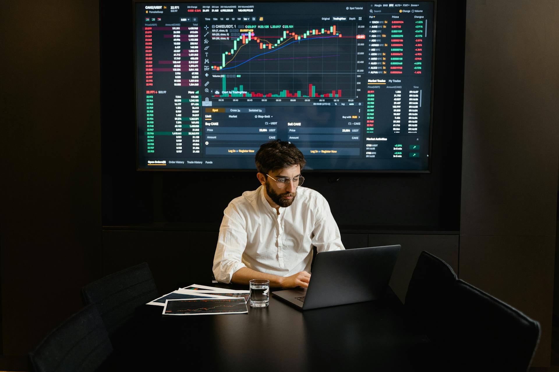 Trader using laptop to access 24/7 synthetic stock index trading on a Perp DEX interface