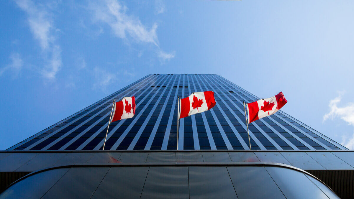 Bank of Canada headquarters with digital compliance documents