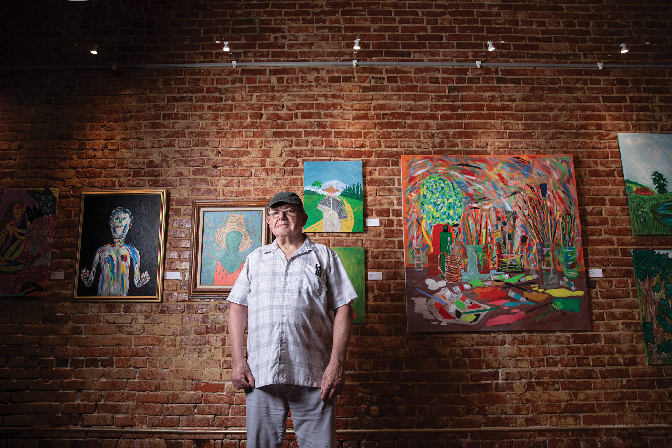 Abstract illustration of a shadowy figure multiplying into dozens of cryptocurrency wallet icons overwhelming a DAO voting ballot box, representing Sybil attacks in decentralized governance