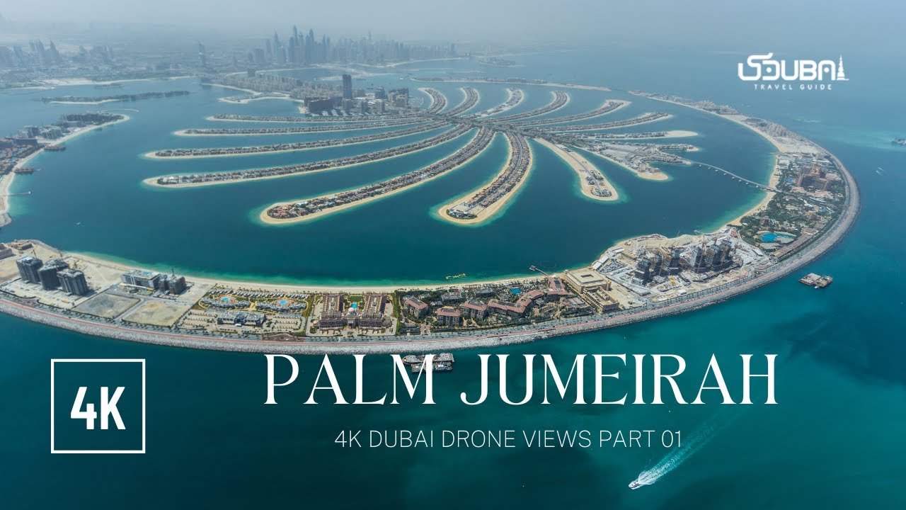 Aerial drone view of luxury tokenized condos in Palm Jumeirah and Downtown Dubai on XRP Ledger, showcasing fractional real estate ownership