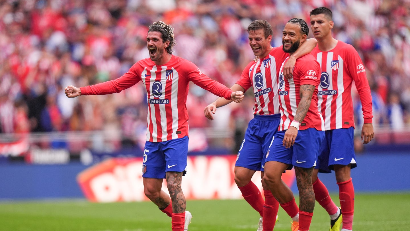Atletico Madrid fans celebrating and interacting with Atletico Madrid Fan Token at a match, showcasing digital fan engagement in 2024.