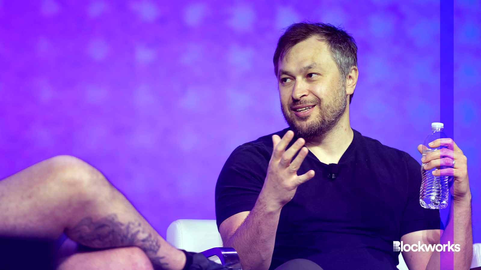 Anatoly Yakovenko speaking on stage at Solana All In Summit 2025 in New York City, addressing the audience about Solana's latest advancements.