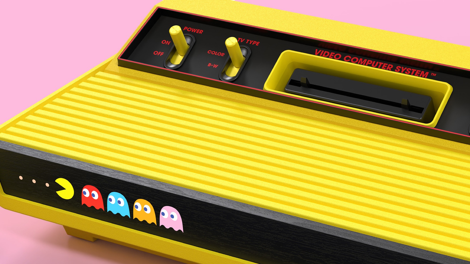 Bright yellow Atari 2600+ Pac-Man Edition retro console with included Pac-Man Double Feature cartridge and ghost joysticks for nostalgic family gaming giveaways