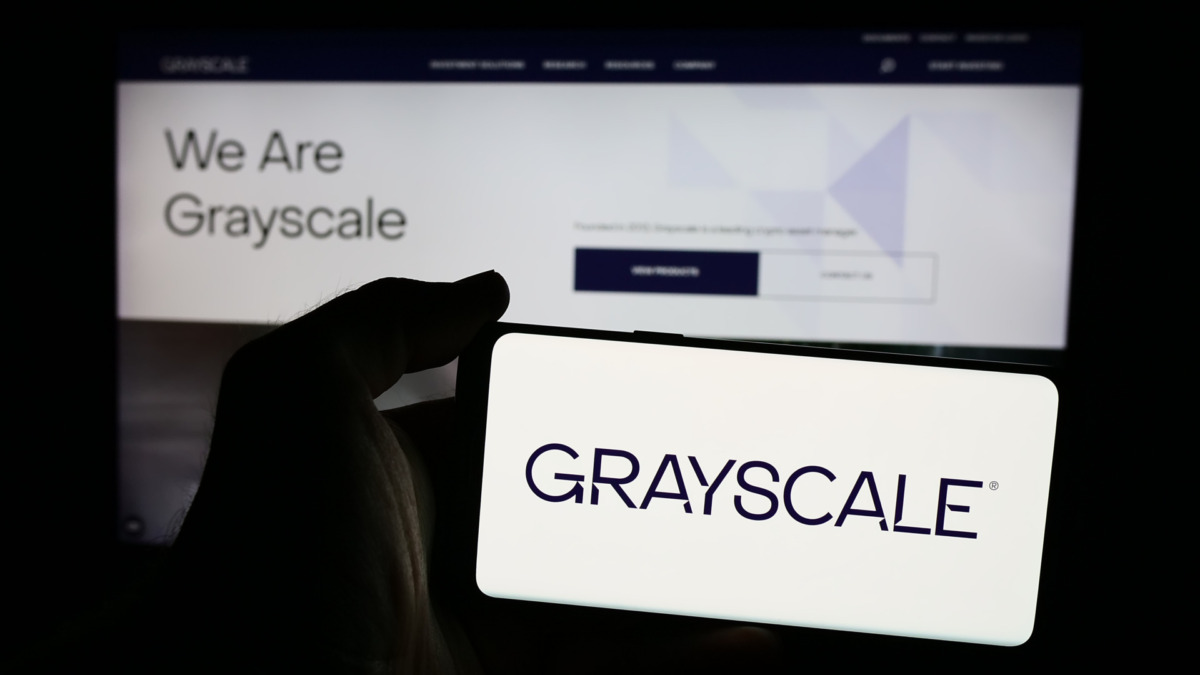 Close-up of Grayscale Digital Large Cap Fund ETF trading screen with digital representations of Bitcoin, Ethereum, XRP, Solana, and Cardano