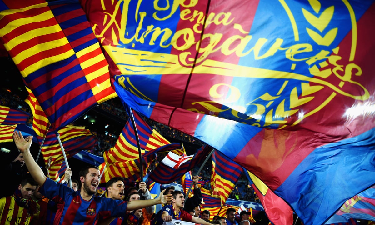 European soccer fans using mobile apps at a stadium to vote on club decisions with fan tokens