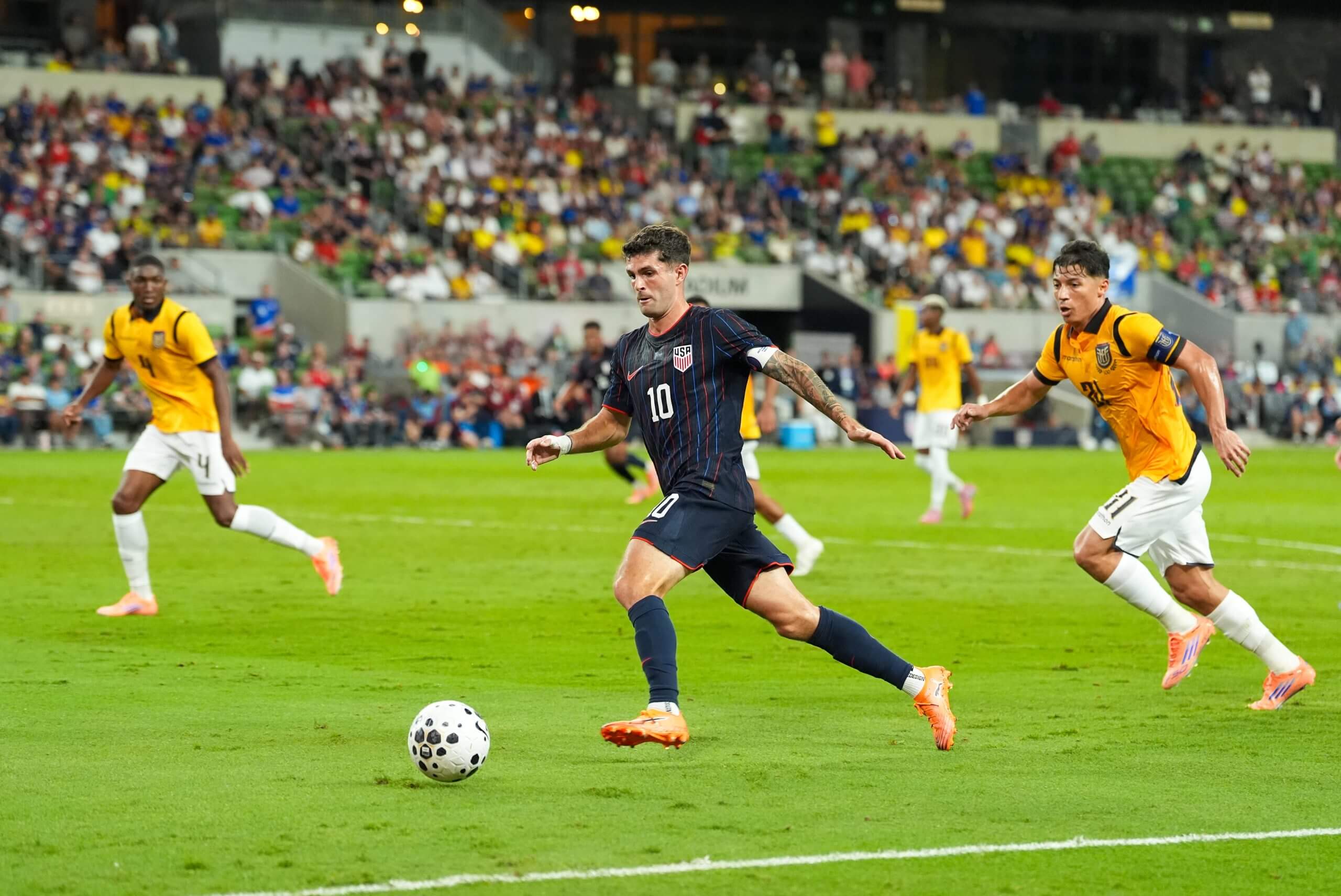 Football fans at a stadium waving club scarves and holding smartphones showing $PSG, $BAR, $JUV, and $SANTOS fan token apps