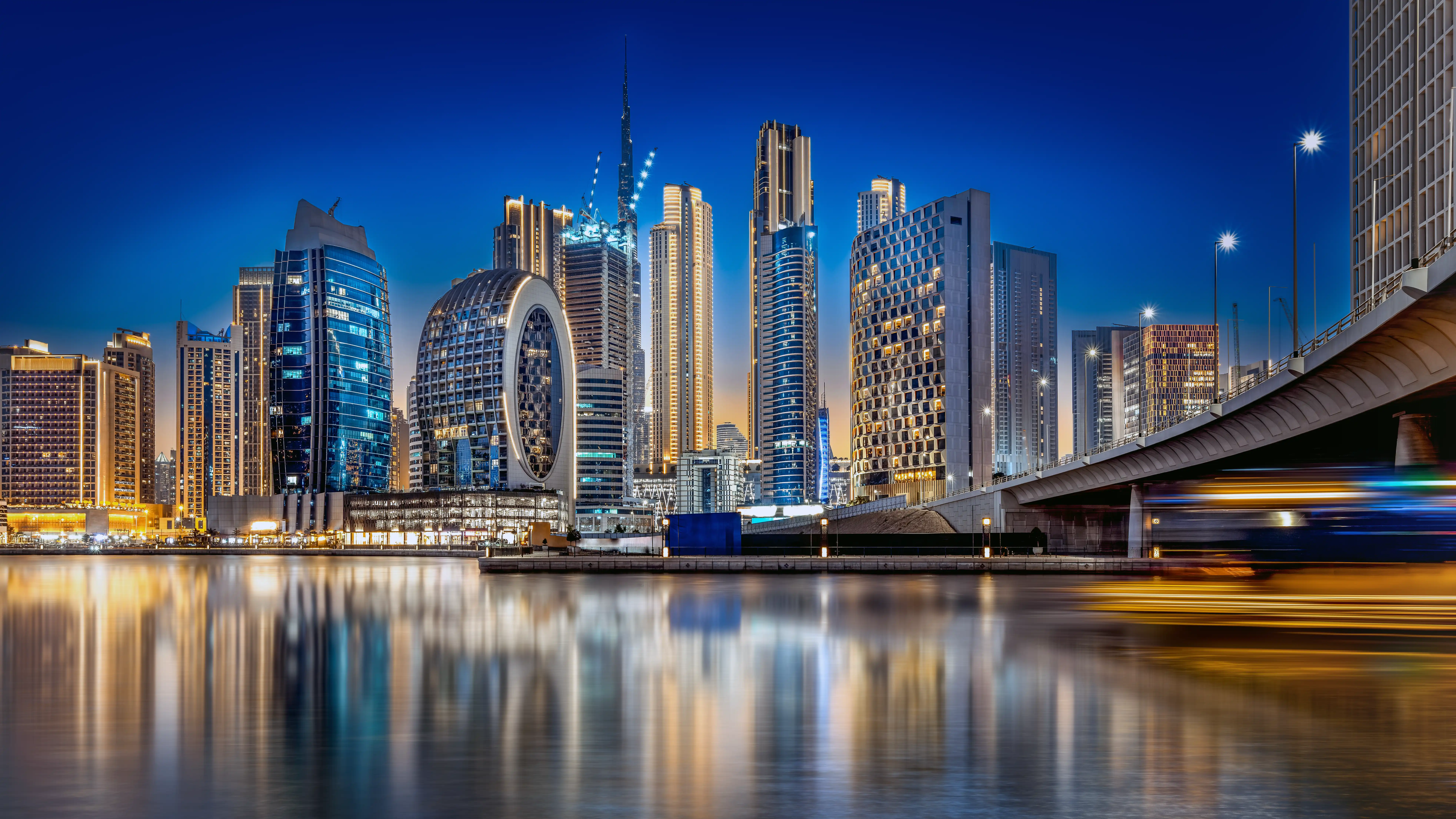 Futuristic Dubai skyline with glowing blockchain tokens overlaying real estate buildings, symbolizing tokenized fractional ownership in emerging markets 2026
