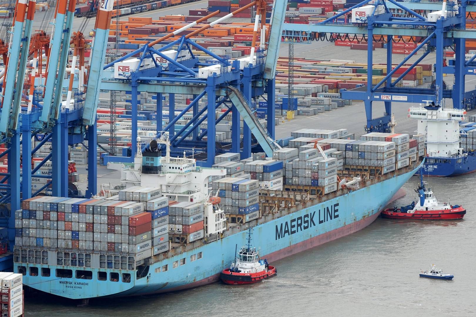 Karachi port bustling with cargo ships, containers, and cranes showcasing active trade in Pakistan