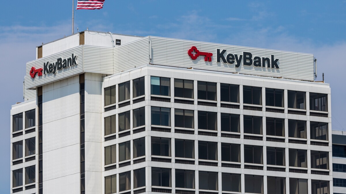 KeyBank headquarters building with a digital Bitcoin symbol overlay, representing crypto integration in US banking
