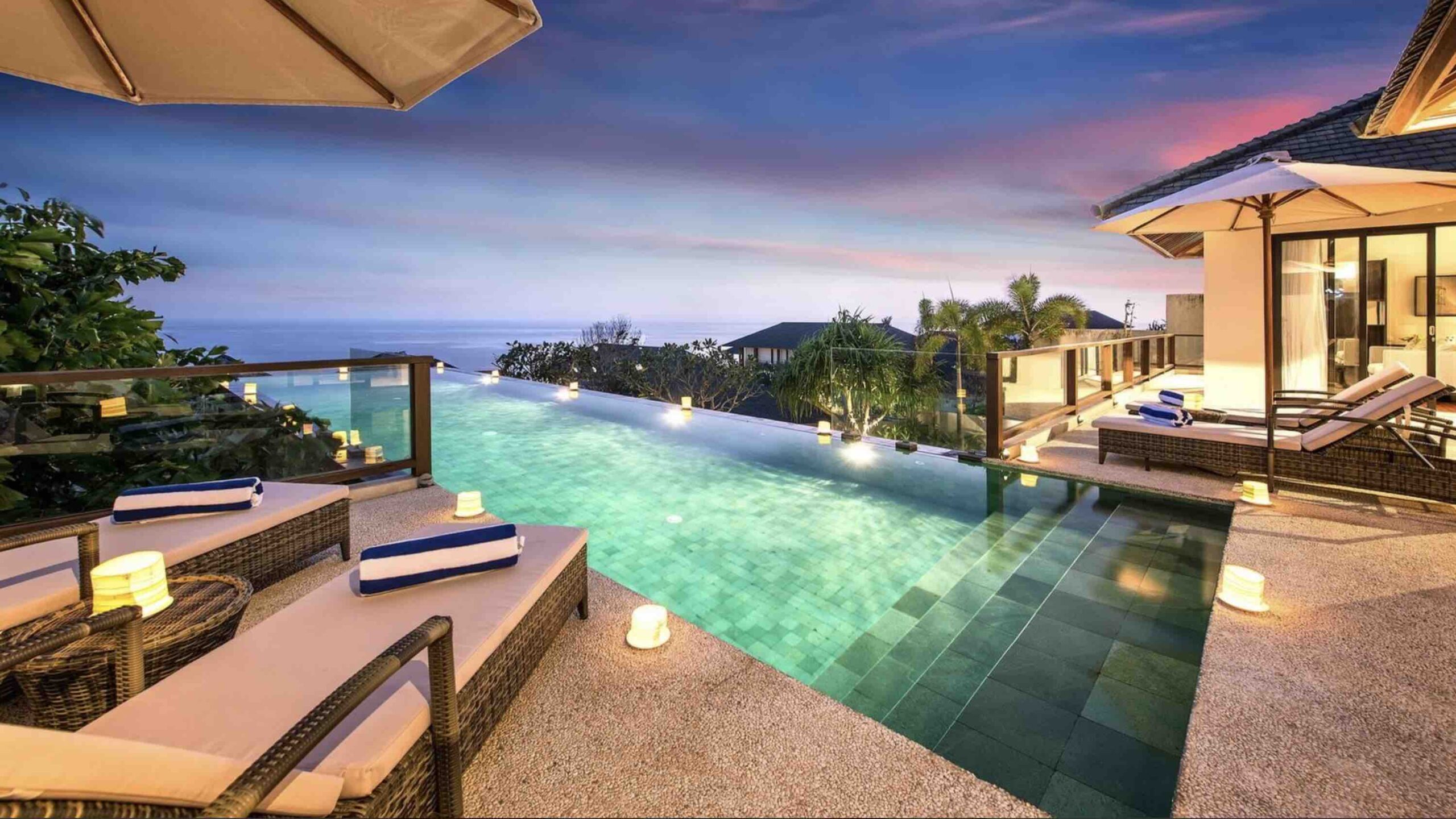 Luxurious Bali villa at sunset with infinity pool and panoramic ocean view, perfect for USDT stablecoin bookings and crypto-friendly vacations