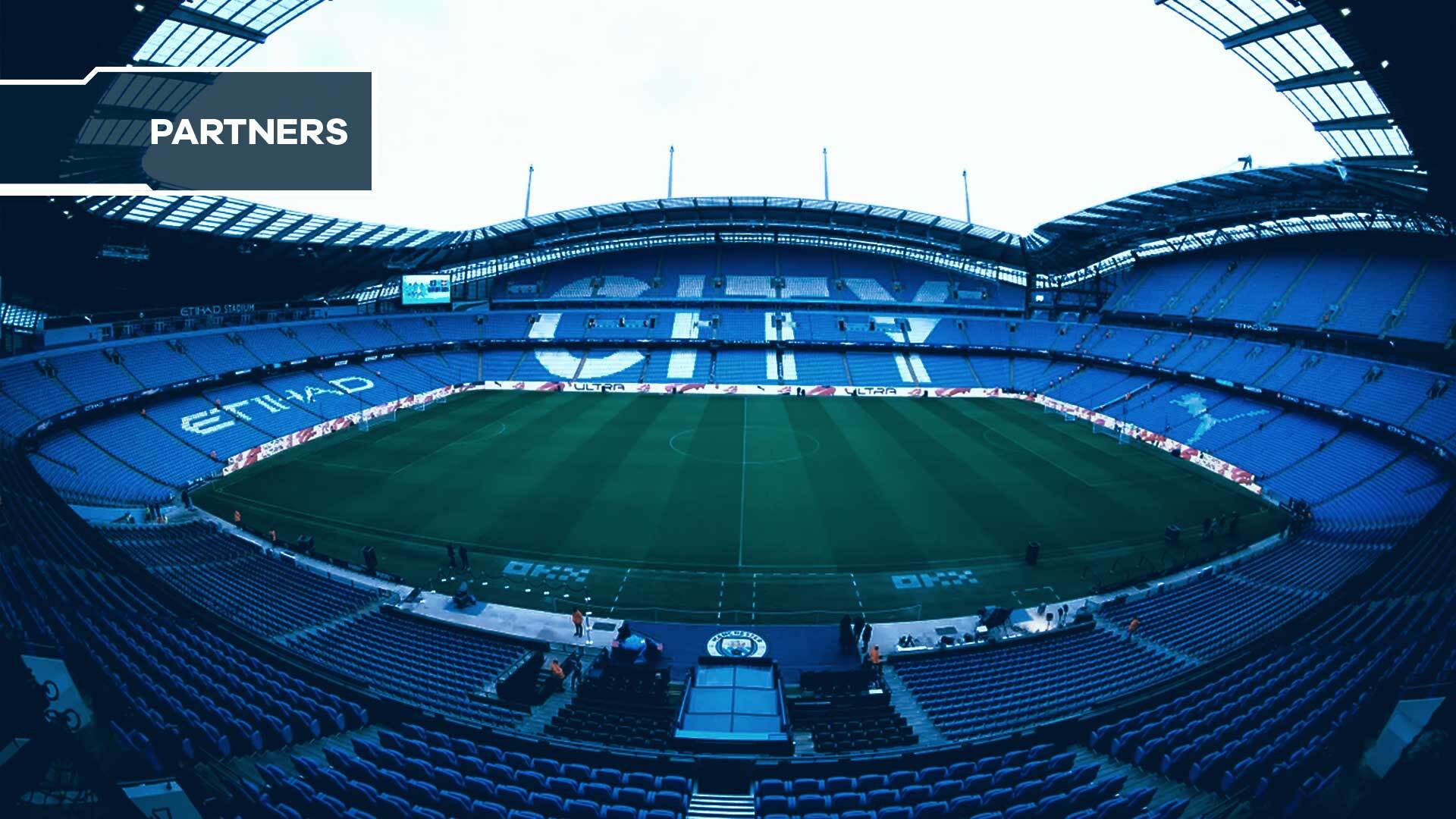 Manchester City fan token holders enjoying VIP hospitality in a premium box at Etihad Stadium during a 2024 matchday, showcasing exclusive fan experiences and digital engagement.
