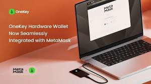OneKey hardware wallet placed on a desk beside a laptop, showcasing multi-chain crypto security setup