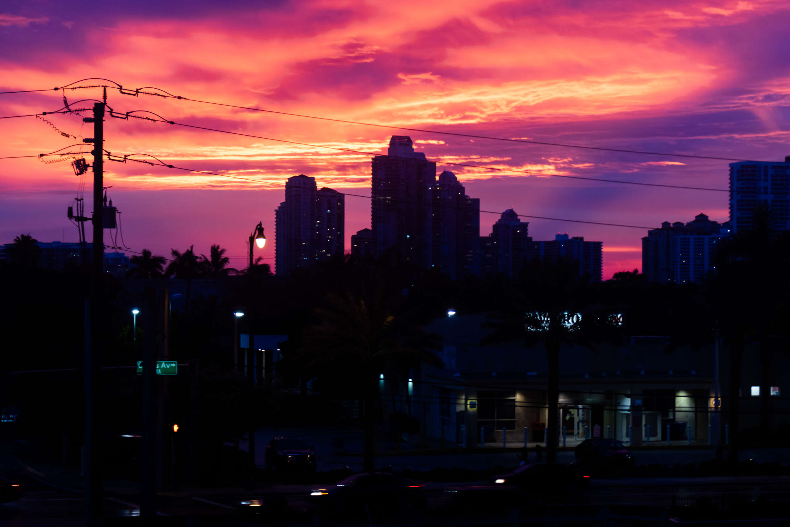 DAWN Black Box node installed on a rooftop overlooking a modern city skyline, representing decentralized internet infrastructure on Solana blockchain.