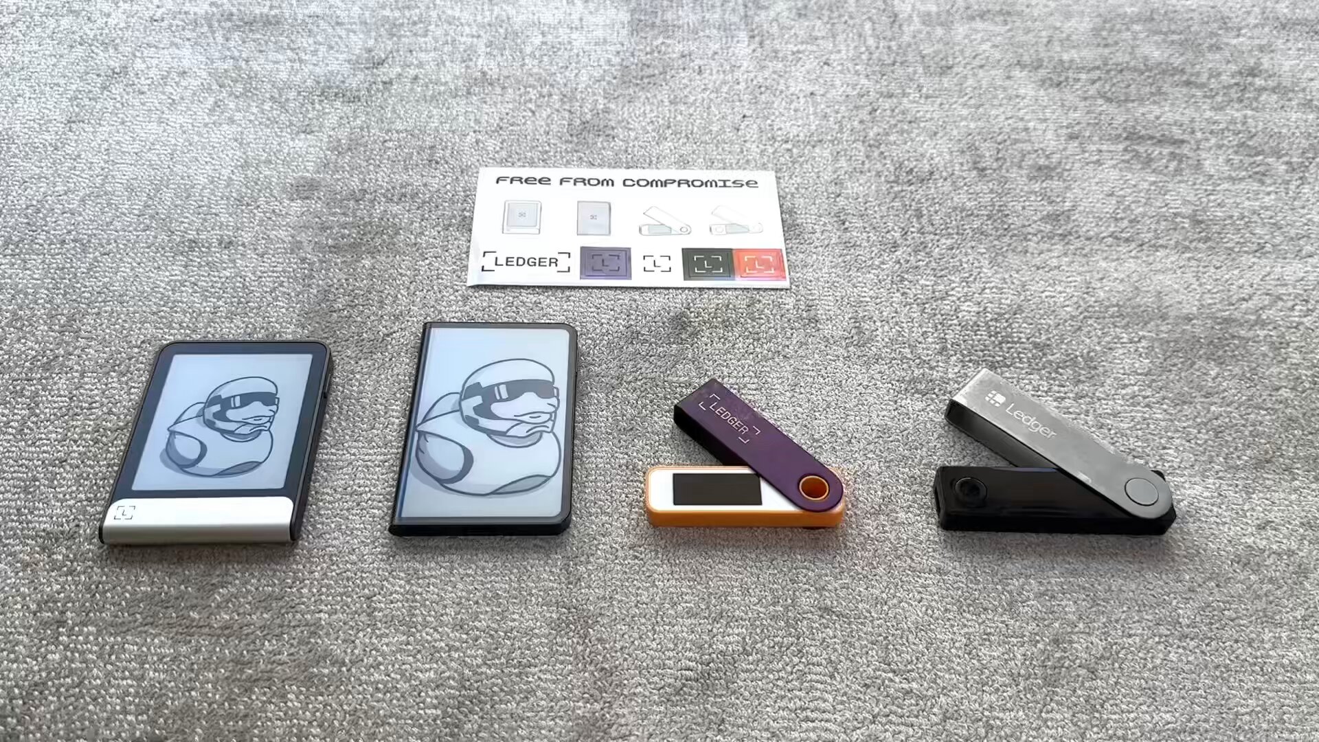 Side-by-side comparison photo of Ledger Flex and Ledger Stax hardware wallets highlighting screen size differences