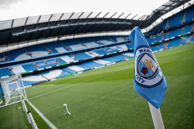 Vibrant pitchside view of Etihad Stadium during Manchester City match, showcasing exclusive VIP access areas and hospitality perks for $CITY Fan Token holders 2025