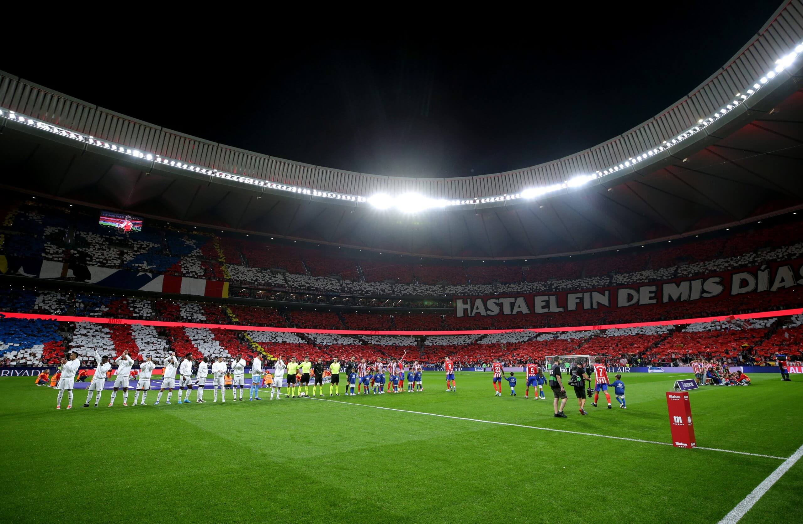 Vibrant graphic of Atletico Madrid stadium overlaid with Binance ATM staking interface showing $1.13 price and reward calculator for fan token investment
