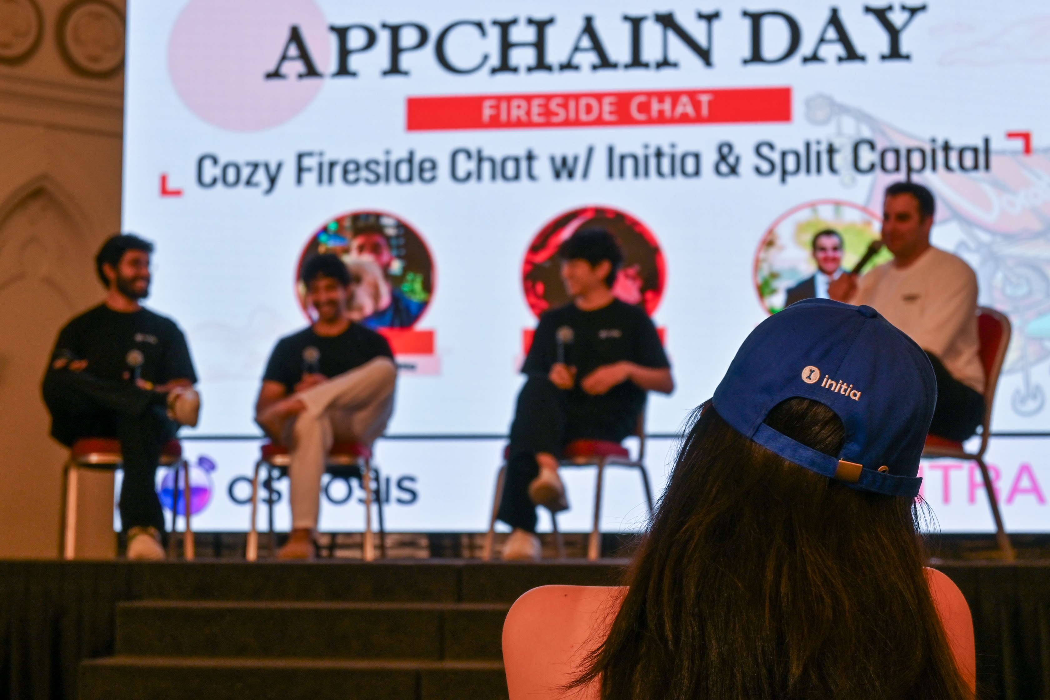 Web3 startup team celebrating successful app-chain launch with laptops and blockchain visuals